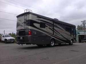 Black and grey rv from behind